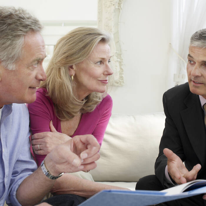 Bigstock Mature couple sitting on sofa 48344651