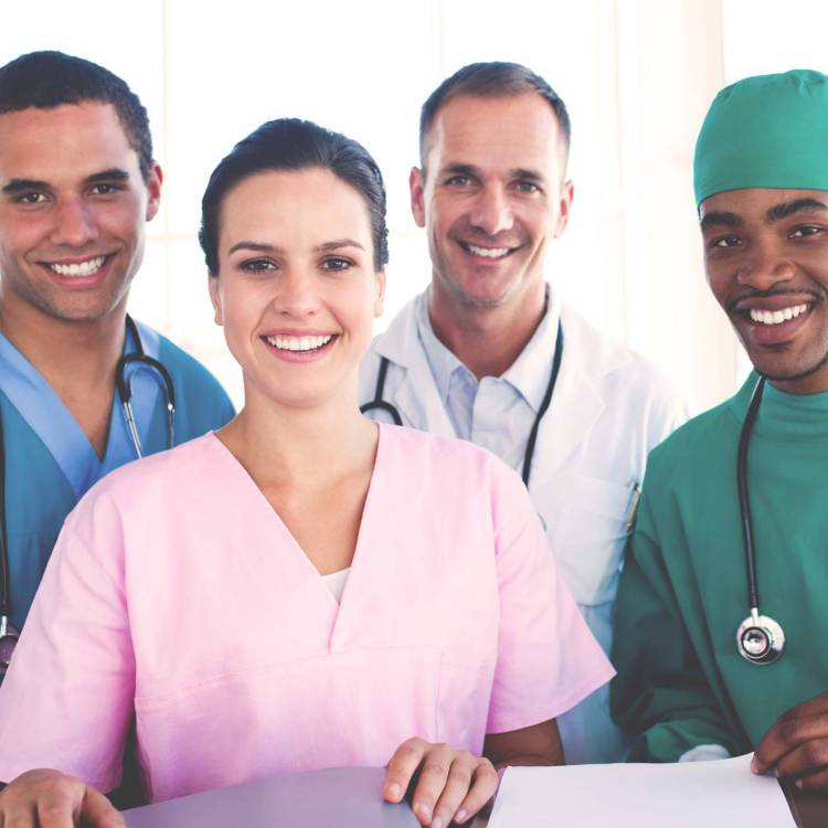 Group of diverse medical professionals in various fields standing together