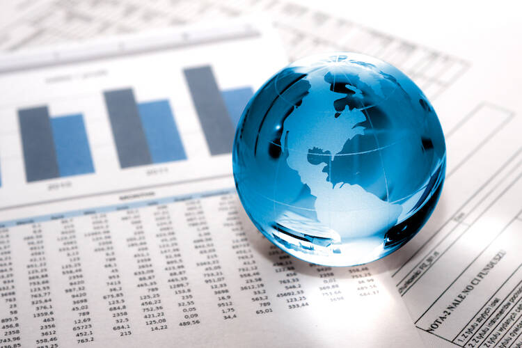 Glass Globe sitting on stock paper documents