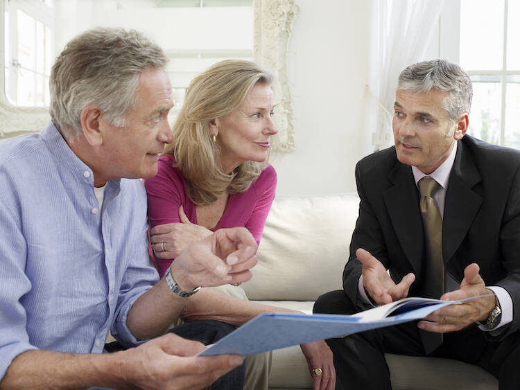 Retired couple talking to expert advisor about financial planning