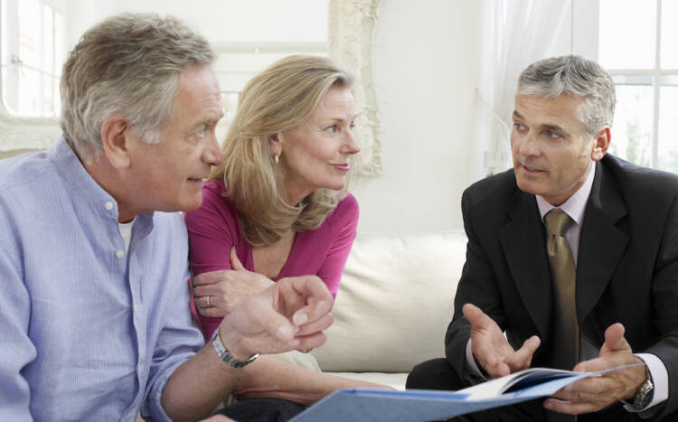 Bigstock Mature couple sitting on sofa 48344651